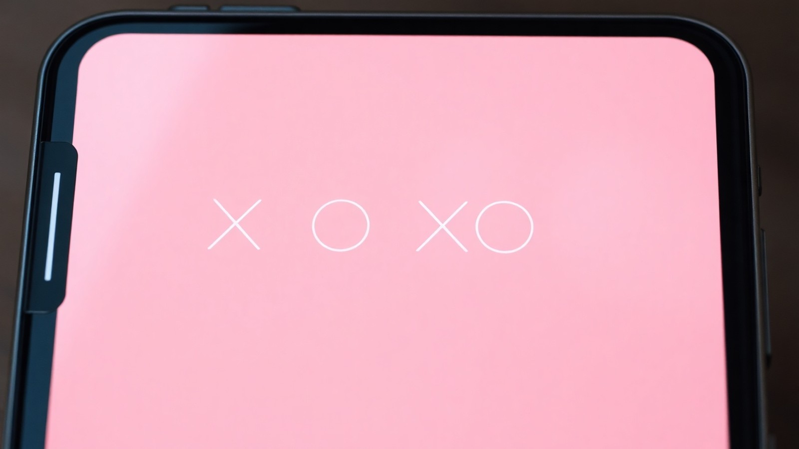 significado xoxo em tela de celular